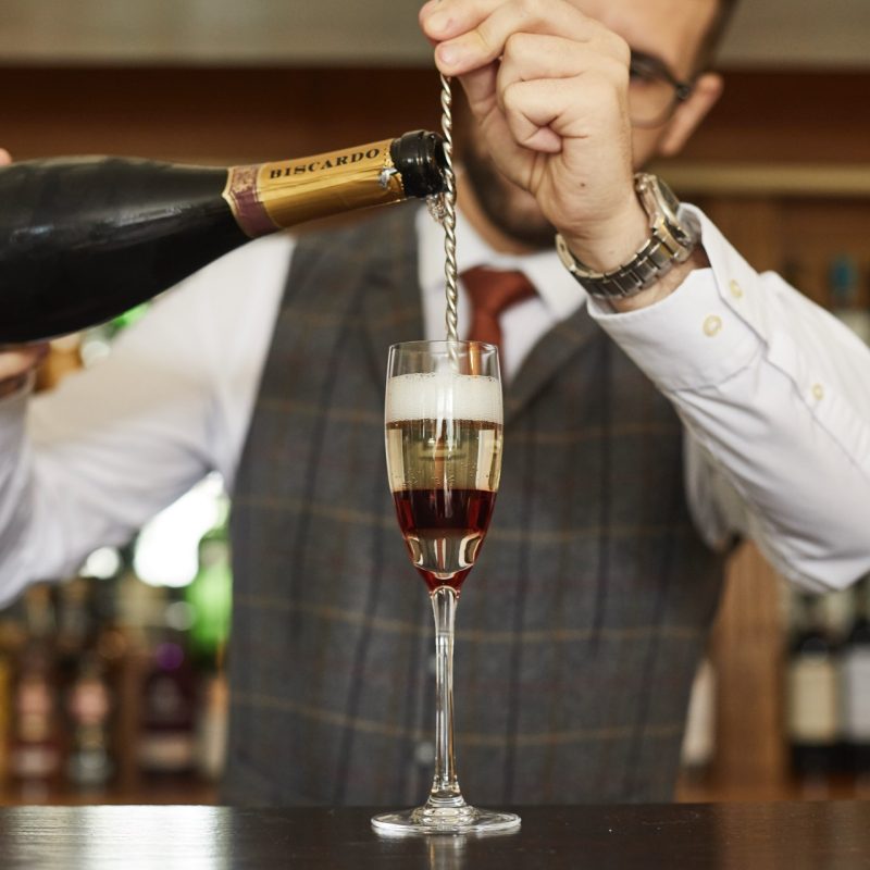 the making of a cocktail for guests