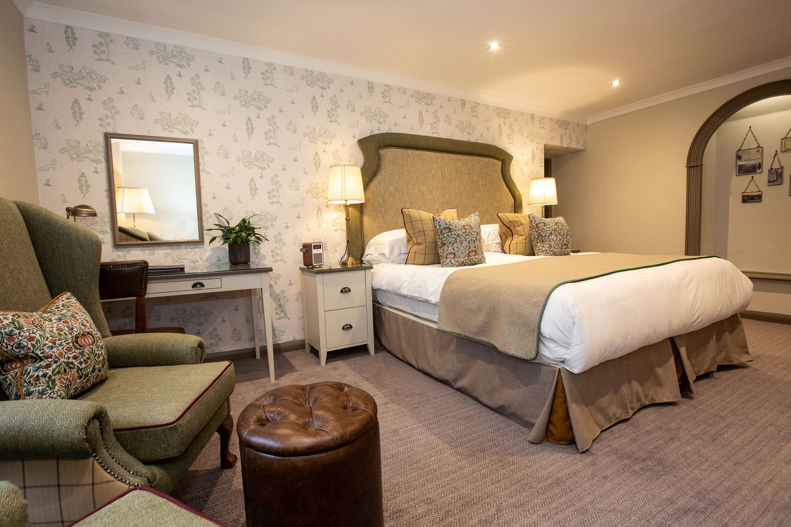 Double bed with seating area for guests